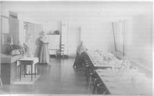 SA0458f - One side of the photo shows a dining room, where tables are set for a meal, and three women. The other side shows the Field Hotel in Lebanon Springs, NY.